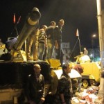 Protestors on a tank in Cairo, Egypt