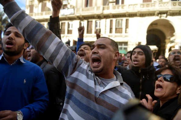 Egyptian protesters shout slogans against President Mohamed Morsi during a demonstration outside the high court in central Cairo on January 30, 2013.