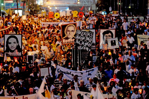 More than 10,000 Catholics gathered to commemorate the 30th anniversary of the assassination of of Archbishop Oscar Arnulfo Romero, a prominent human rights defender who was murdered during the Salvadorean civil war (Photo Credit: Jose Cabezas/AFP/Getty Images).