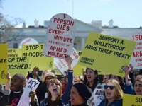 Amnesty activists rally outside the White House in support of a strong Arms Trade Treaty.