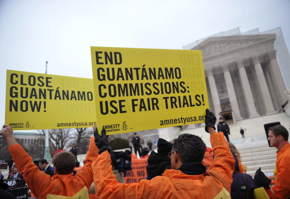 Demonstrators take part in a rally to call for the closing of the Guantanamo Bay detention center (Photo Credit: Mandel Ngan/AFP/Getty Images).