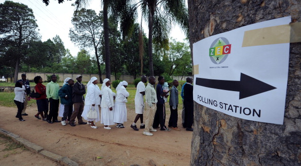 Zimbabweans queue in Chitungwiza to vote at a polling station in a school (Photo Credit: Alexander Joe/AFP/Getty Images).