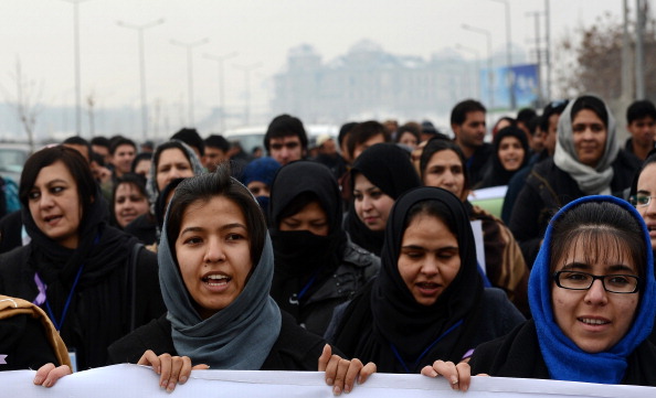 Afghan women march during a protest calling for an end to violence against women in Afghanistan and around the world. According to a U.N. report, Afghanistan has made progress in protecting women against violence, but many still suffer horrific abuse 11 years after a U.S.-led invasion brought down the Taliban regime (Photo Credit: Shah Marai/AFP/Getty Images).