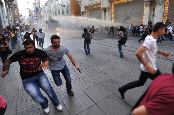 Turkish riot use water cannon to disperse anti-government protestors during clashes at Istiklal street on (Photo Credit: Ozan Kose/AFP/Getty Images).