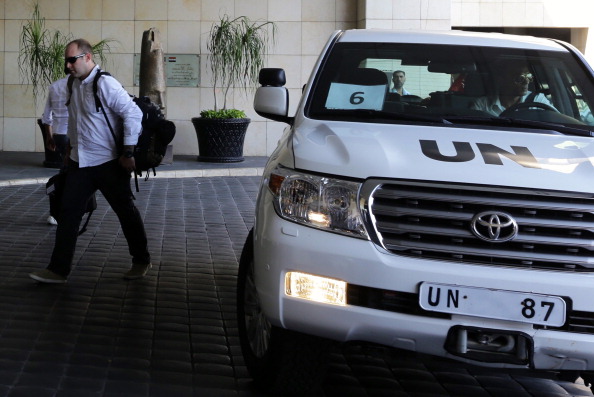 The U.N. chemical weapons investigation team arrives in Damascus on August 18, 2013 (Photo Credit: Louai Beshara/AFP/Getty Images).