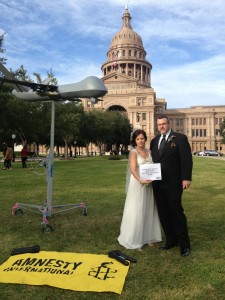 The University of Texas-Austin Amnesty chapter was in the middle of organizing the Die-In when this lovely couple came up. At first we thought they were going to ask us to move so they could take wedding pictures but instead, they wanted to be part of our photo action.