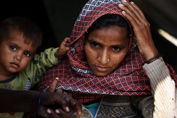 Dilshana Begum, 25, lost her five month old boy to cold at Malakpur camp in Shamli, India (Photo Credit: Raj k Raj/Hindustan Times via Getty Images).