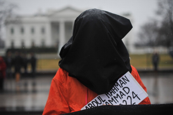 A protester calling for the closing of Guantanamo in front of the White House in Washington on January 11, 2014 to mark the 12th anniversary of the arrival of the first detainees. Today, January 22, 2014, marks the 5th anniversary after President Obama signed an executive order to close the facility (Photo Credit: Nicholas Kamm/AFP/Getty Images).