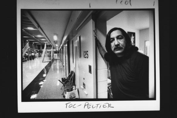 Leonard Peltier, a Chippewa-Lakota Indian serving a life sentence for the murder of 2 FBI agents, posing in the open doorway of his cell at Leavenworth Federal Penitentiary  (Photo Credit: Taro Yamasaki//Time Life Pictures/Getty Images).