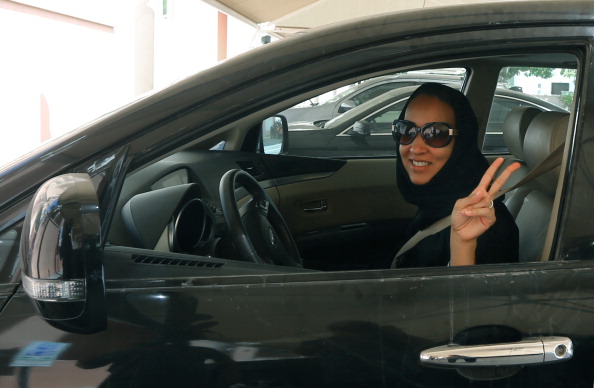 Saudi activist Manal Al Sharif, who now lives in Dubai, flashes the sign for victory in solidarity with Saudi women campaigning for women's right to drive in Saudi Arabia (Photo Credit: Marwan Naamani/AFP/Getty Images).