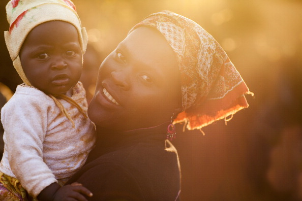 Portrait of a mother with her child in Chimoio, Mozambique (Photo Credit: Ute Grabowsky/Photothek via Getty Images).