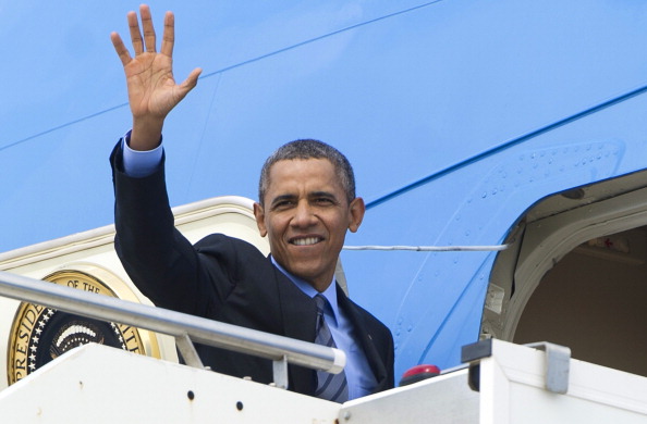 President Obama waves as he boards Air Force One prior to his departure for Saudi Arabia to meet with King Abdullah (Photo Credit: Saul Loeb/AFP/Getty Images).