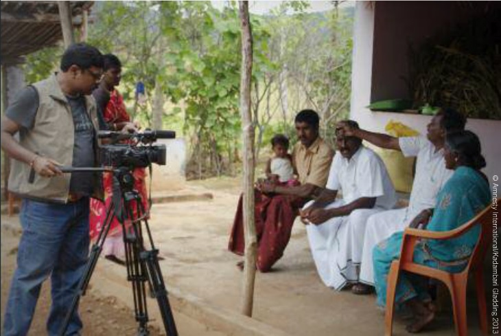 Amnesty staff in India speak to Gnanapragasam, one of the four men sentenced to death in 2002 in south India. All four had their sentences commuted to life on January 21, 2014 (Photo Credit: Amnesty International).