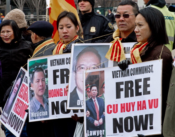 Vietnamese Americans protest on Pennsylvania Avenue, in front of the White House, demanding the release of political prisoners March 5, 2012, in Washington, D.C. Human rights lawyer Cu Huy Ha Vu was recently released (Photo Credit: Paul J. Richards/AFP/Getty Images). 