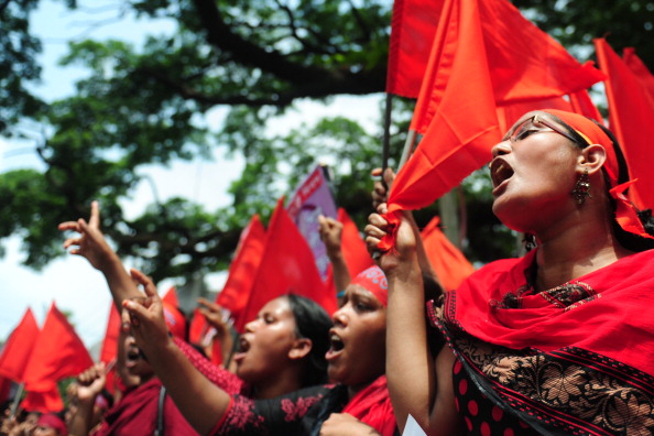 Tens of thousands of Bangladeshis joined the International Workers Day protests this past May to demand the execution of textile bosses over the collapse of a factory complex, as rescuers warned the final toll could be more than 500 (Photo Credit: Munir Uz Zaman/AFP/Getty Images).