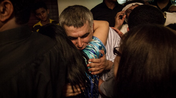 A crowd receives human rights defender Nabeel Rajab after his release from prison. (Photo credit: Hussain Albahrani/Pacific Press/LightRocket via Getty Images).