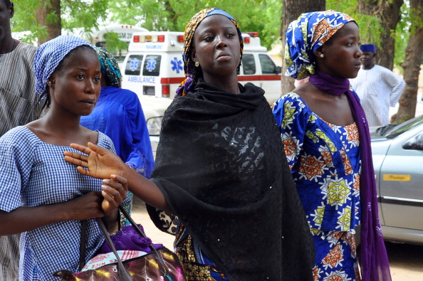 Schoolgirls who escaped from the Boko Haram arrive at the Government House to speak with the State Governor after protests supporting the kidnapped girls were banned in Nigeria's capital, Abuja (Photo Credit: STR/AFP/Getty Images).