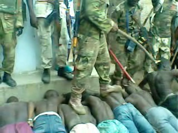 Images taken from a video of a 'screening' operation by the Nigerian military and Civilian Joint Task Force on 23 July 2013 in Bama town, Nigeria. More than 300 men were passed in front of a hidden informant. Up to 35 men were arrested on suspicion of being Boko Haram members.