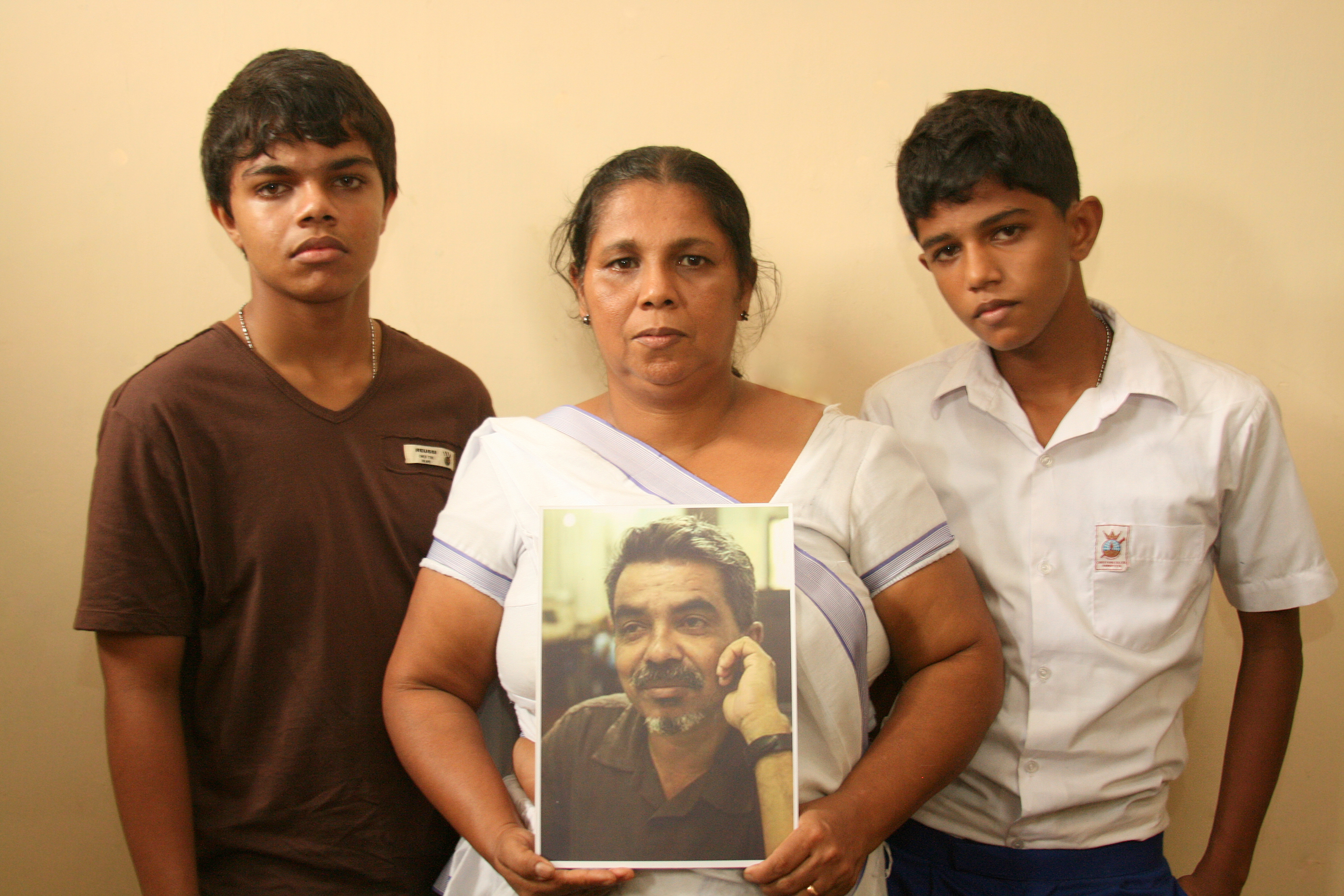 Sandya Eknaligoda wife of disappeared journalist Prageeth Eknaligoda with with their two sons Sathyajith Sanjaya and Harith Danajaya