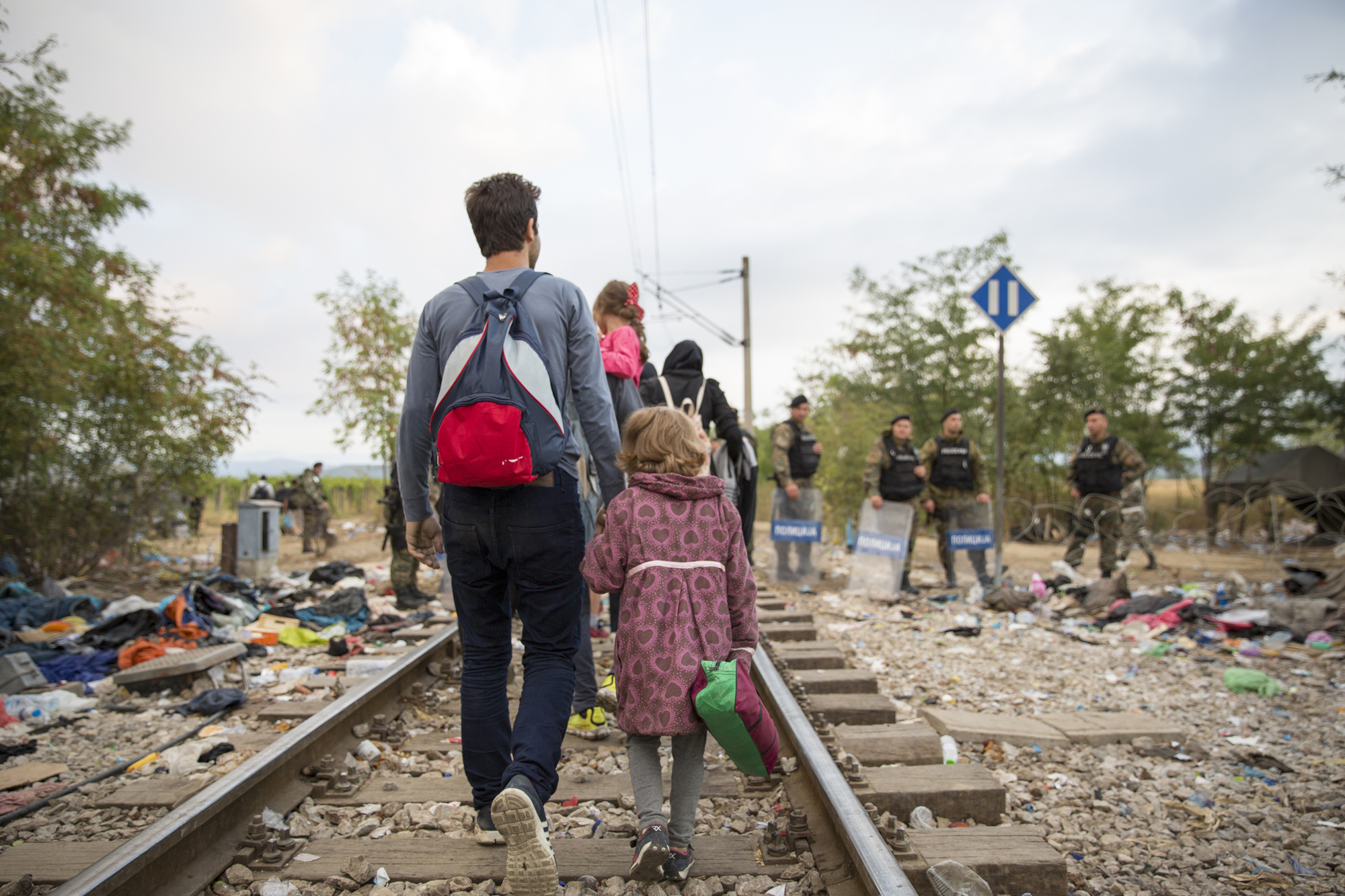 Refugees and migrants cross the border from Greece into Macedonia, 24 August 2015.