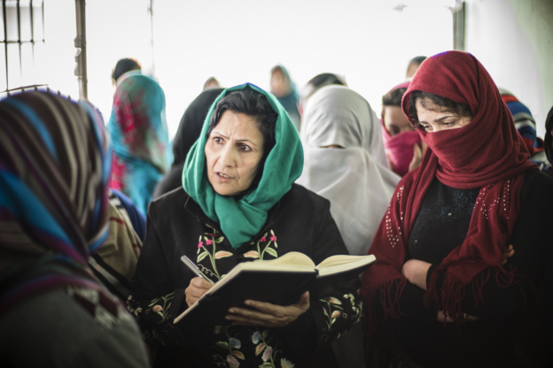 Fawzia Nawabi, investigator at the Afghanistan Independent Human Rights Commission, Mazar-e-Sharif, gathers information in a local women's prison.