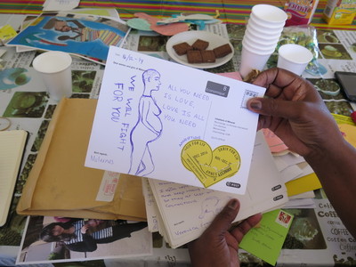 Solidarity messages from W4R 2014 are delivered to inhabitants of Mkhondo, Mpumalanga, South Africa. This card shows a drawing of a pregnant woman and the message - we will fight for you.