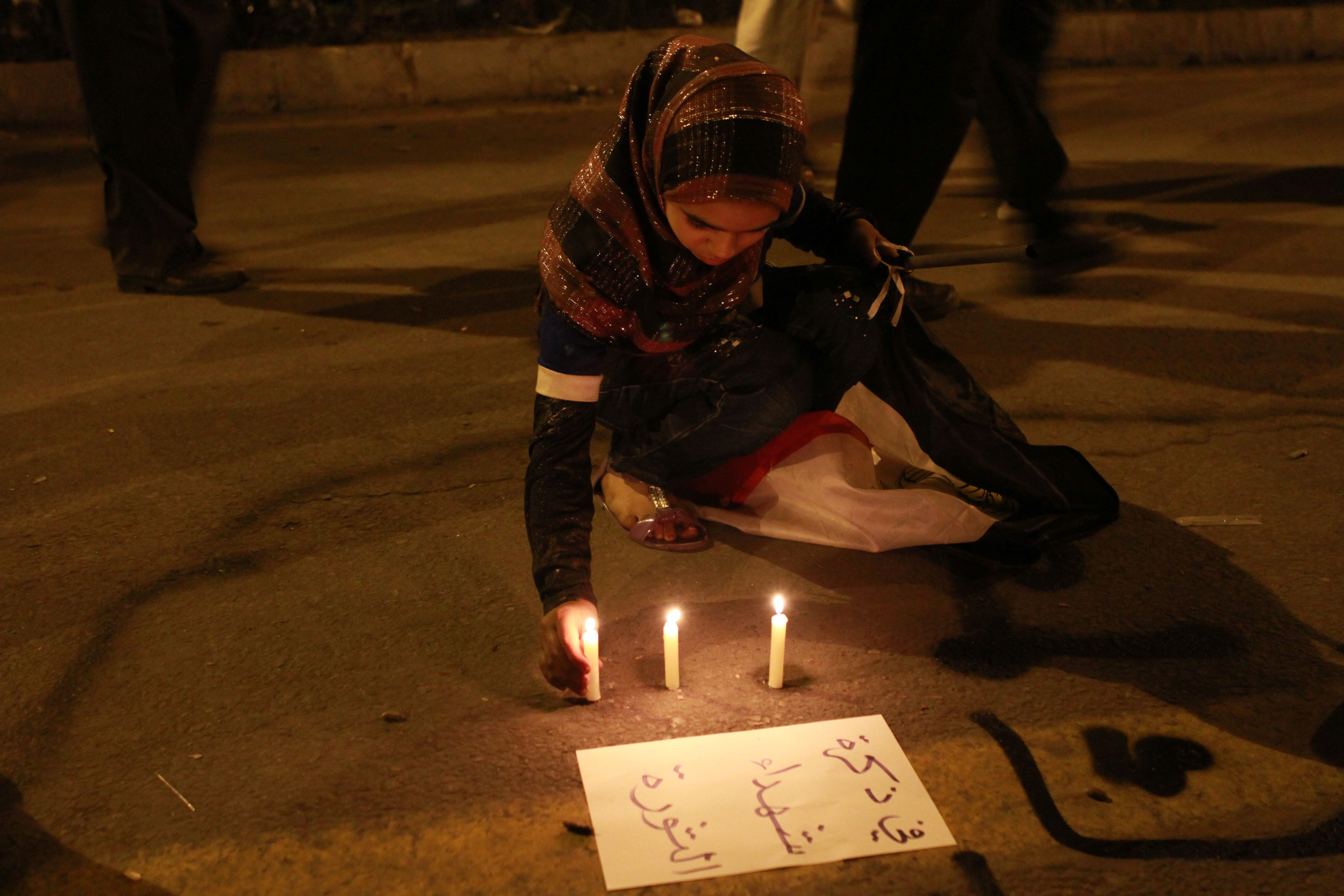 Celebrating the resignation of President Mubarak, Cairo, Egypt, 11 February 2011. Lighting candles &quot;in memory of the revolution's martyrs&quot;.