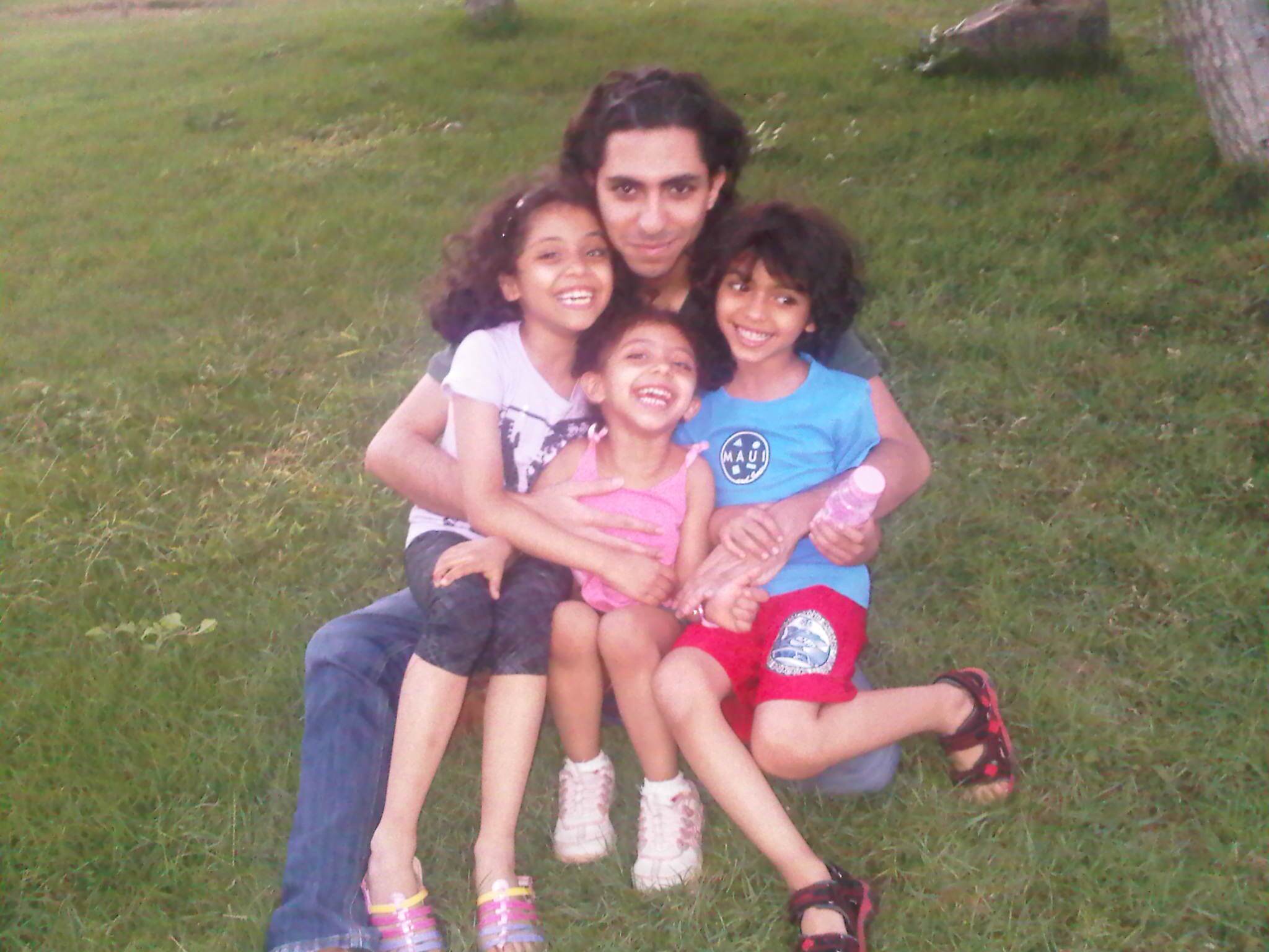 Raif Badawi with his kids.