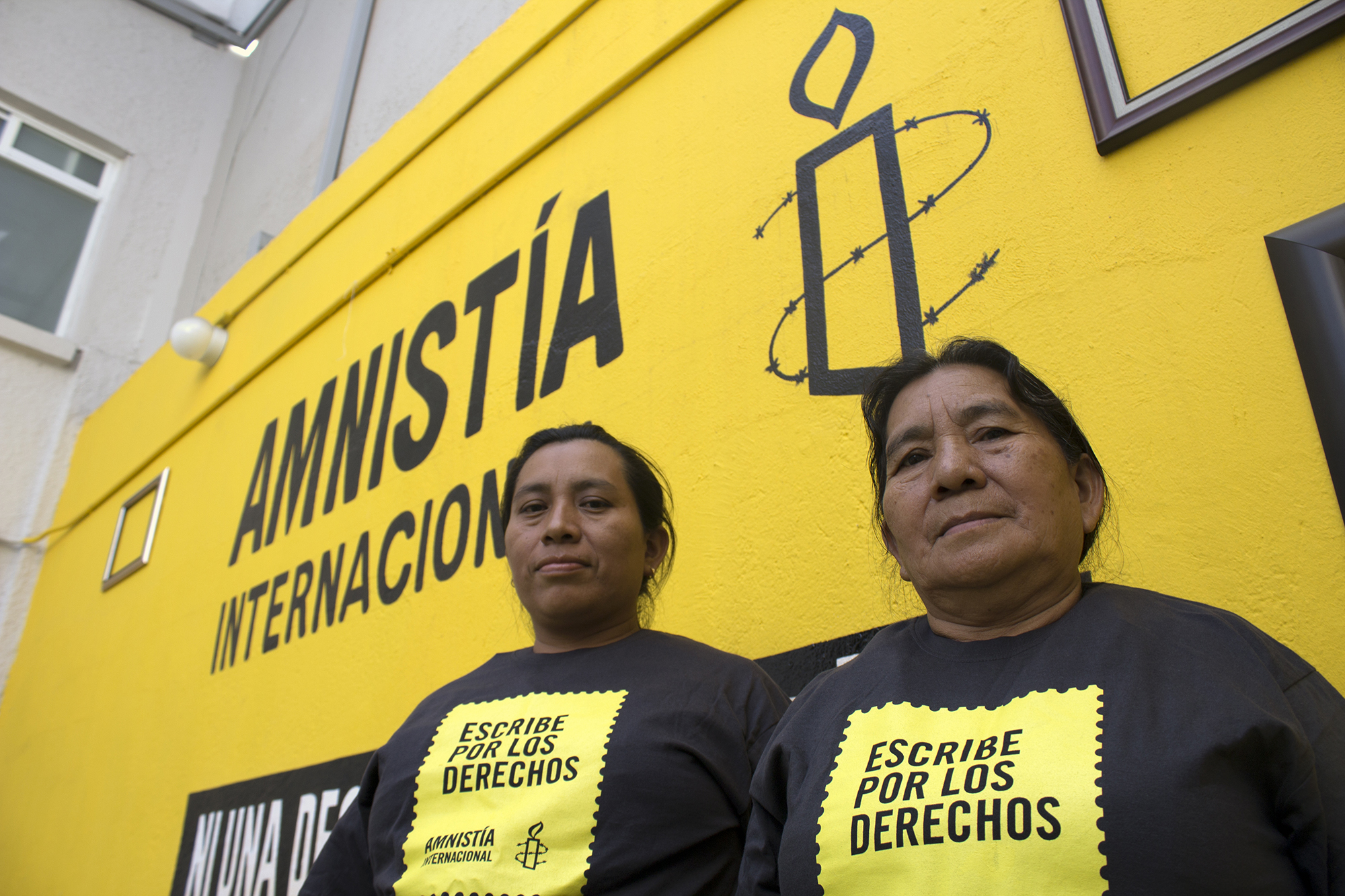 Cecilia Vásquez Sánchez and María Elena Sánchez, Teodora Vásquez Sánchez's sister and mother, pose at Amnesty International's office in Mexico City. Both are wearing Amnesty International tee shirts. In 2008, Teodora del Carmen Vásquez was sentenced to 30 years in prison for “aggravated homicide” after suffering a still-birth at work. Teodora, mother of an 11-year-old boy, was expecting a new baby when she started experiencing increasingly severe pain. She called the emergency services but her waters broke soon afterwards. She went into labour, and was unconscious when she gave birth. When she came round, bleeding profusely, her baby was dead. Police at the scene handcuffed her and arrested her on suspicion of murder. Only then did they take her to hospital where she could get the urgent treatment she needed. In El Salvador, women who miscarry or suffer a still-birth during pregnancy are routinely suspected of having had an “abortion”. Abortion under any circumstance is a crime, even in cases of rape, incest, or where a woman’s life is at risk. This makes women afraid to seek help with pregnancy-related problems, leading inevitably to more preventable deaths.