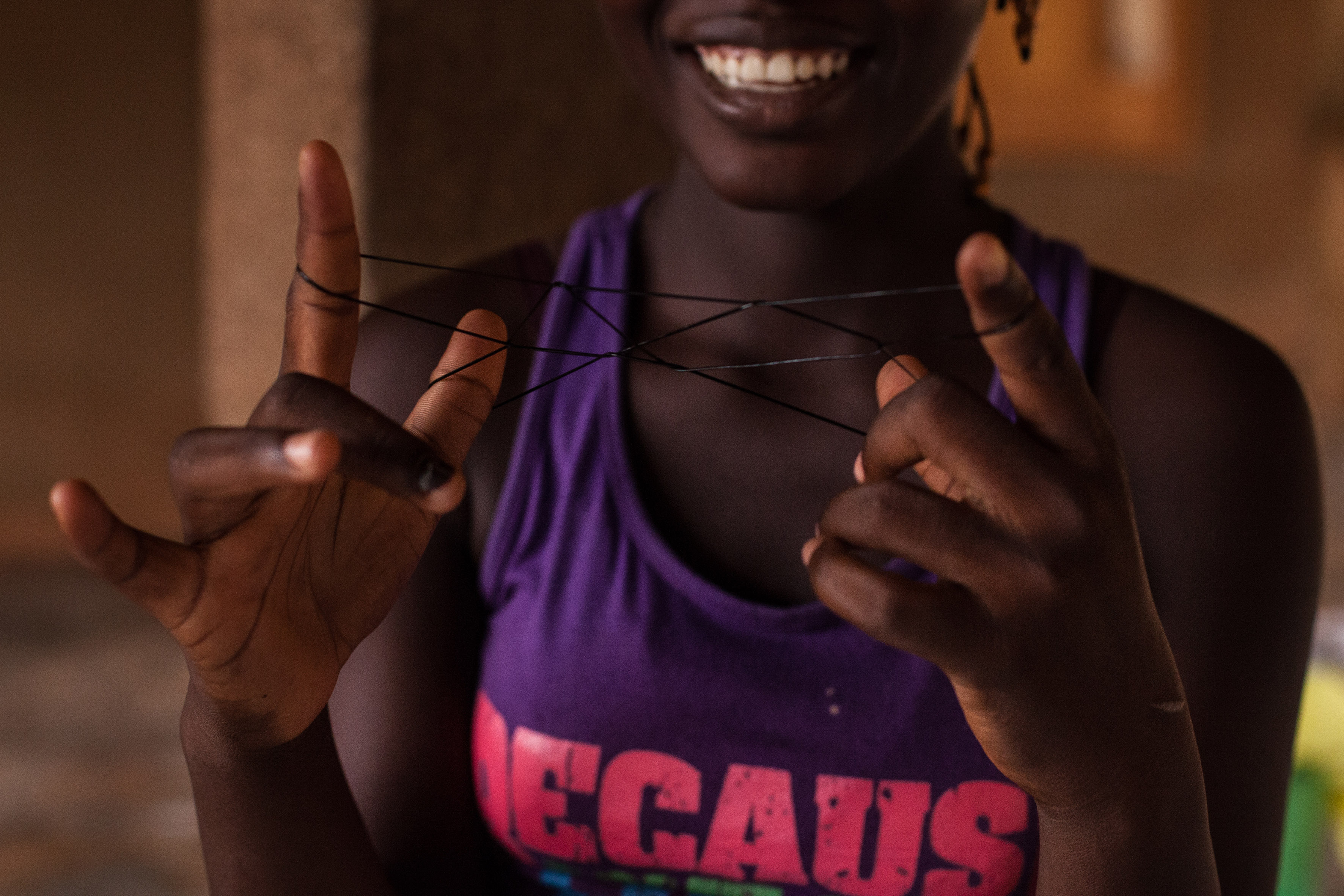 Playing with elastic bands – a typical game played by girls aged 7 to 12 in Burkina Faso. Girls relax and reconnect with their childhoods at Foceb shelter for survivors of rape, early and forced marriage and unwanted pregnancy in central Ouagadougou, capital of Burkina Faso. The shelter takes in girls aged as young as 12 to as old as 18. Between 2001 and 2009, the shelter accommodated a total of 209 girls and 168 children. In Burkina Faso, girls who get pregnant outside marriage are often rejected by their families. Places like Foceb give them the opportunity to rebuild their lives. In Burkina Faso, 52% of all girls are forced into marriage – the 7th highest rate for child marriage in the world.