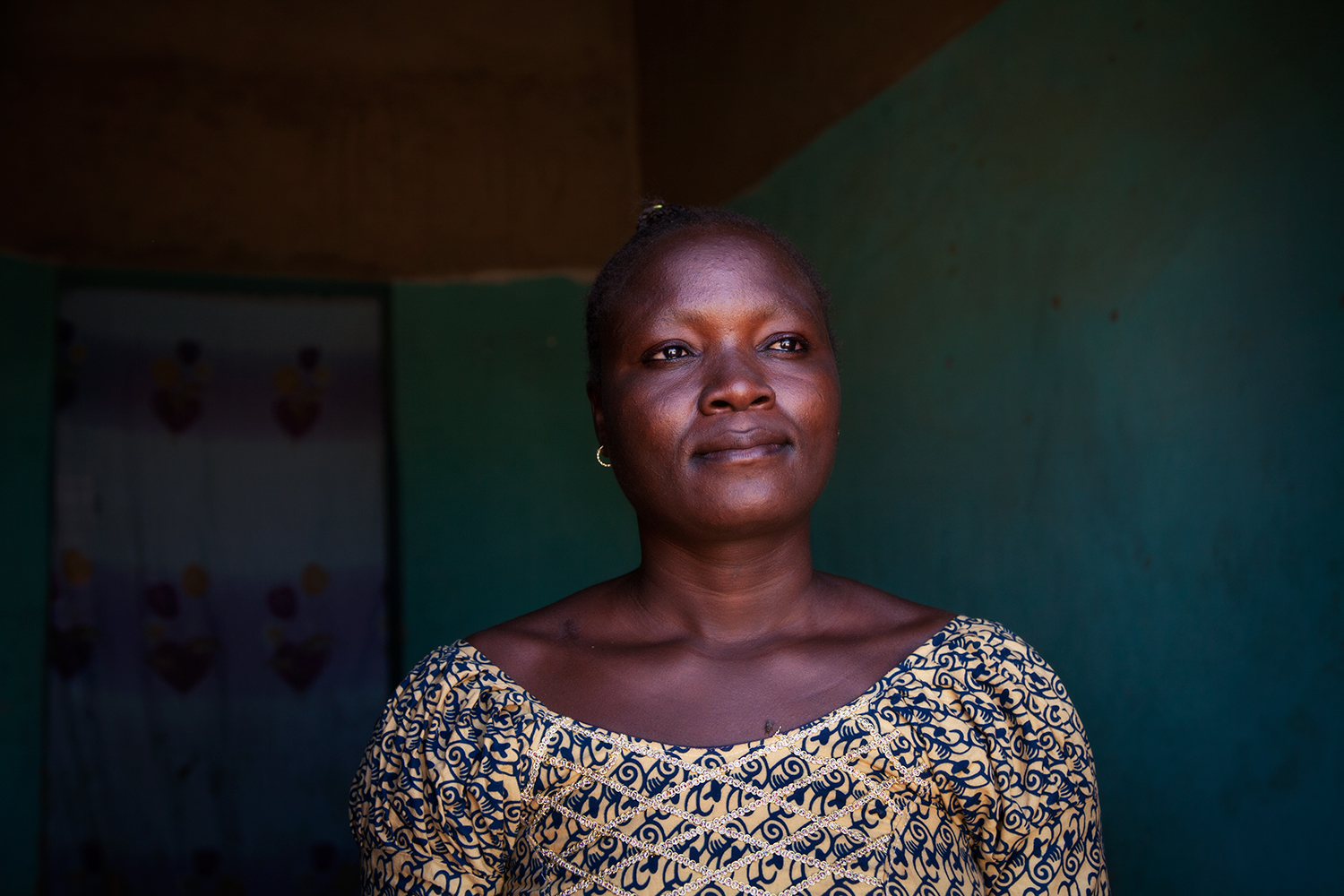 Awa Ouédraogo photographed by Leila Alaoui in Ouagadougou, Burkina Faso, on 13 January 2016, as part of the My Body My Rights campaign. Awa Ouédraogo is fruit seller in Ouagadougou and a former resident of the Pan Bila shelter for survivors of forced marriage, rape and unwanted pregnancy in Ouagadougou. When she fell pregnant at age 14, she was rejected by her family, lived in the street and gave birth to her child one evening in a shop where she took refuge. Awa spent a few years at Pan Bila with her child and is now independent and able to provide for herself and her child thanks to her fruit stall.