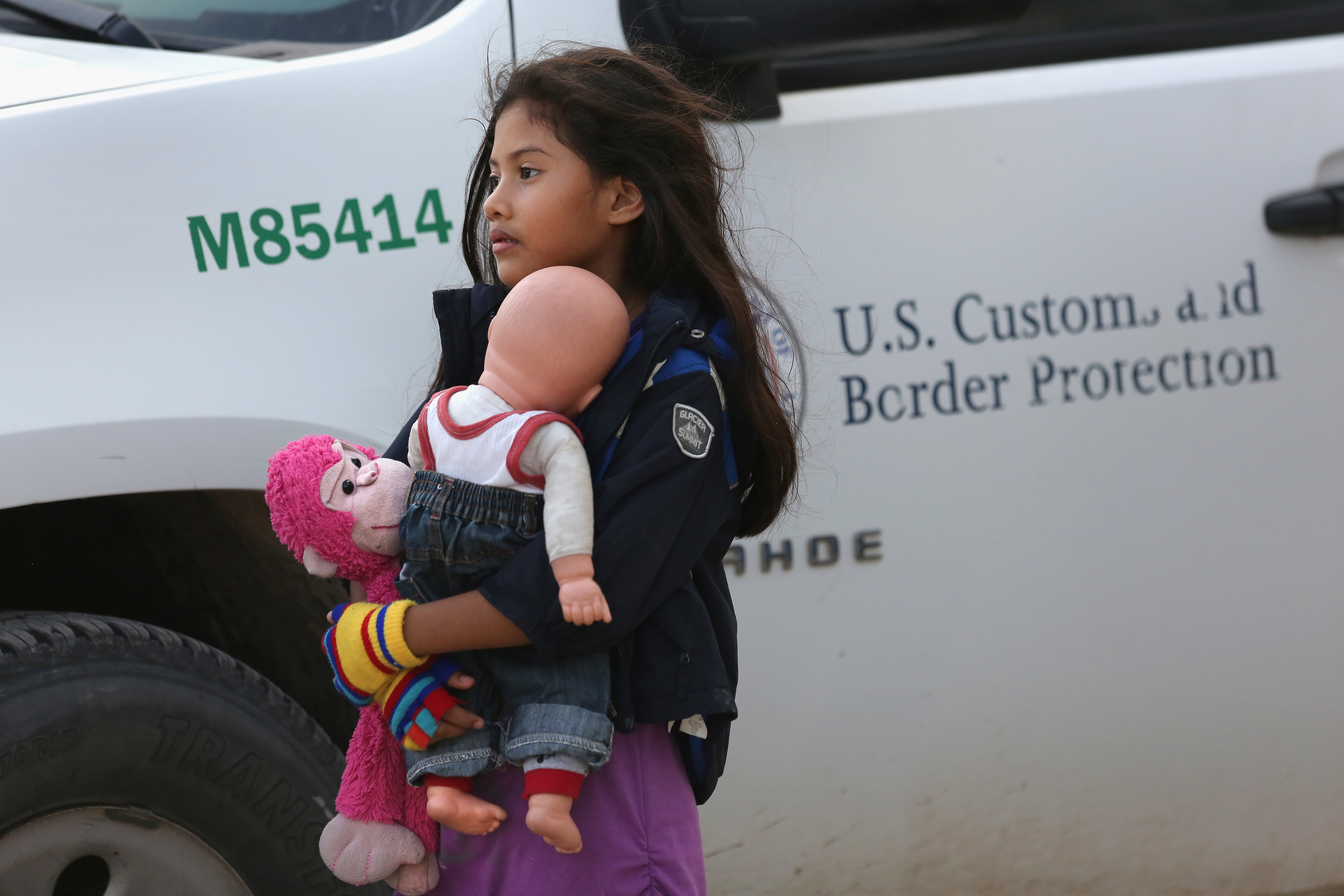 Salvadorian immigrant Stefany Marjorie, 8, holds her doll Rodrigo ( John Moore/Getty Images)