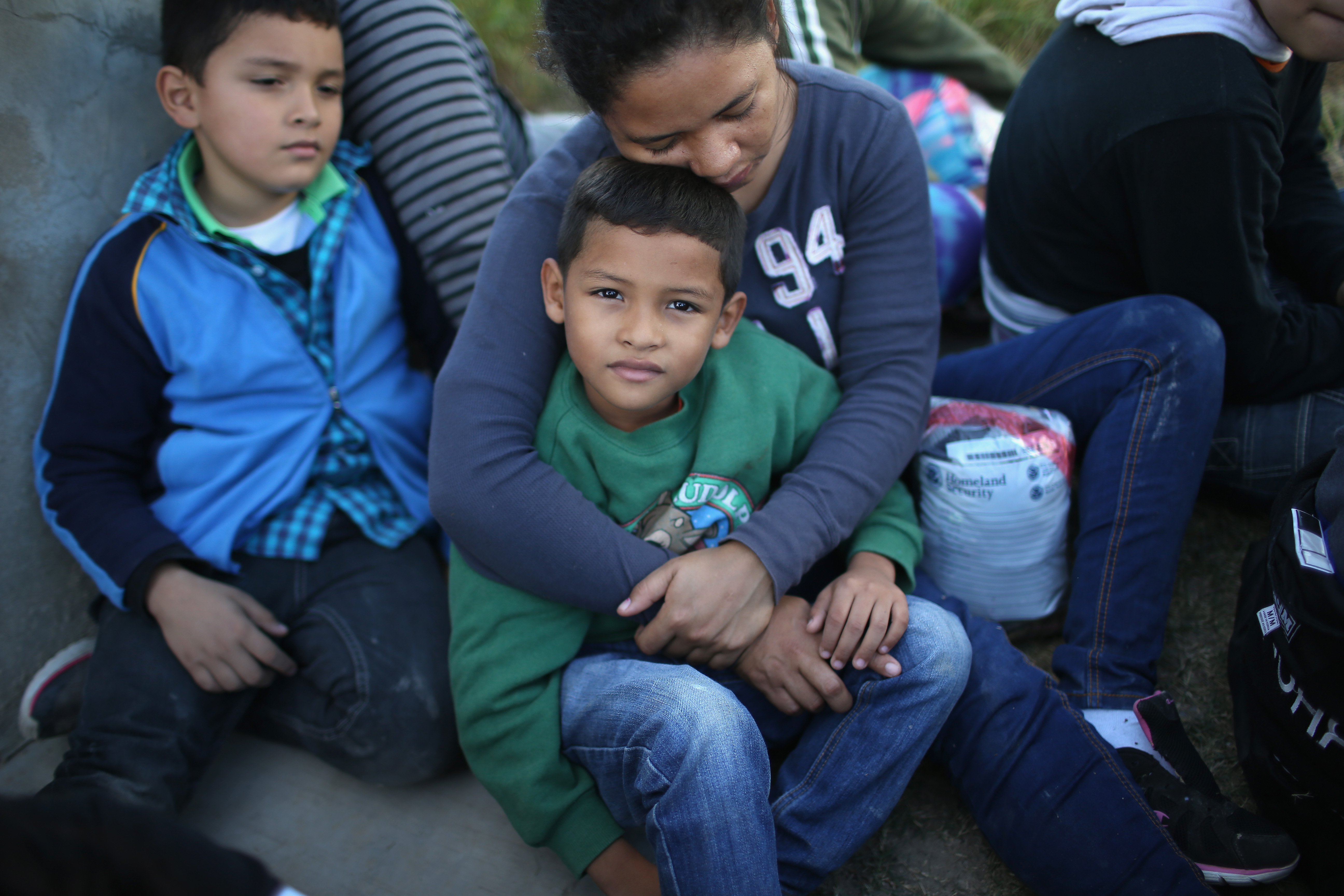 Honduran mother holds her son, 7 ( John Moore/Getty Images)