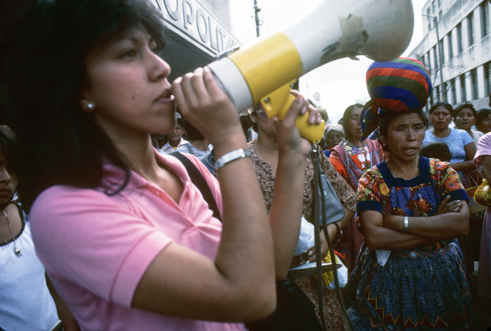Rosario Godoy de Cuevas speaks into a megaphone at a demonstration at a GAM in Guatemala, 1985.  Grupo de Apoyo Mutuo (GAM; Mutual Support Group) support group for families whose relatives had &quot;disappeared&quot;.