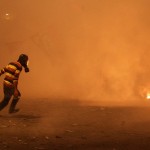 egyptian protester run tear gas