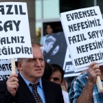 Supporter of Turkish pianist Fazil Say holds a sign in support of Say.