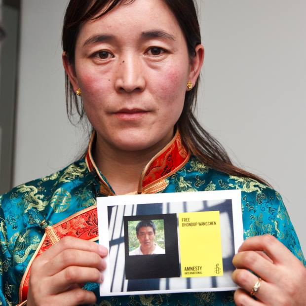 Tibetan filmmaker Dhondup Wangchen risked everything to document China's worsening repression in Tibet. Now he's behind bars away from his wife wife Lhamo Tso (pictured here) and their daughter Tenzin (Photo Credit: Amnesty International).