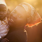 Portrait of a mother with her child in Chimoio, Mozambique (Photo Credit: Ute Grabowsky/Photothek via Getty Images).