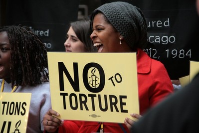 Activists march with Chicago torture survivors at Amnesty International USA's 2014 human rights conference in Chicago, Illinois