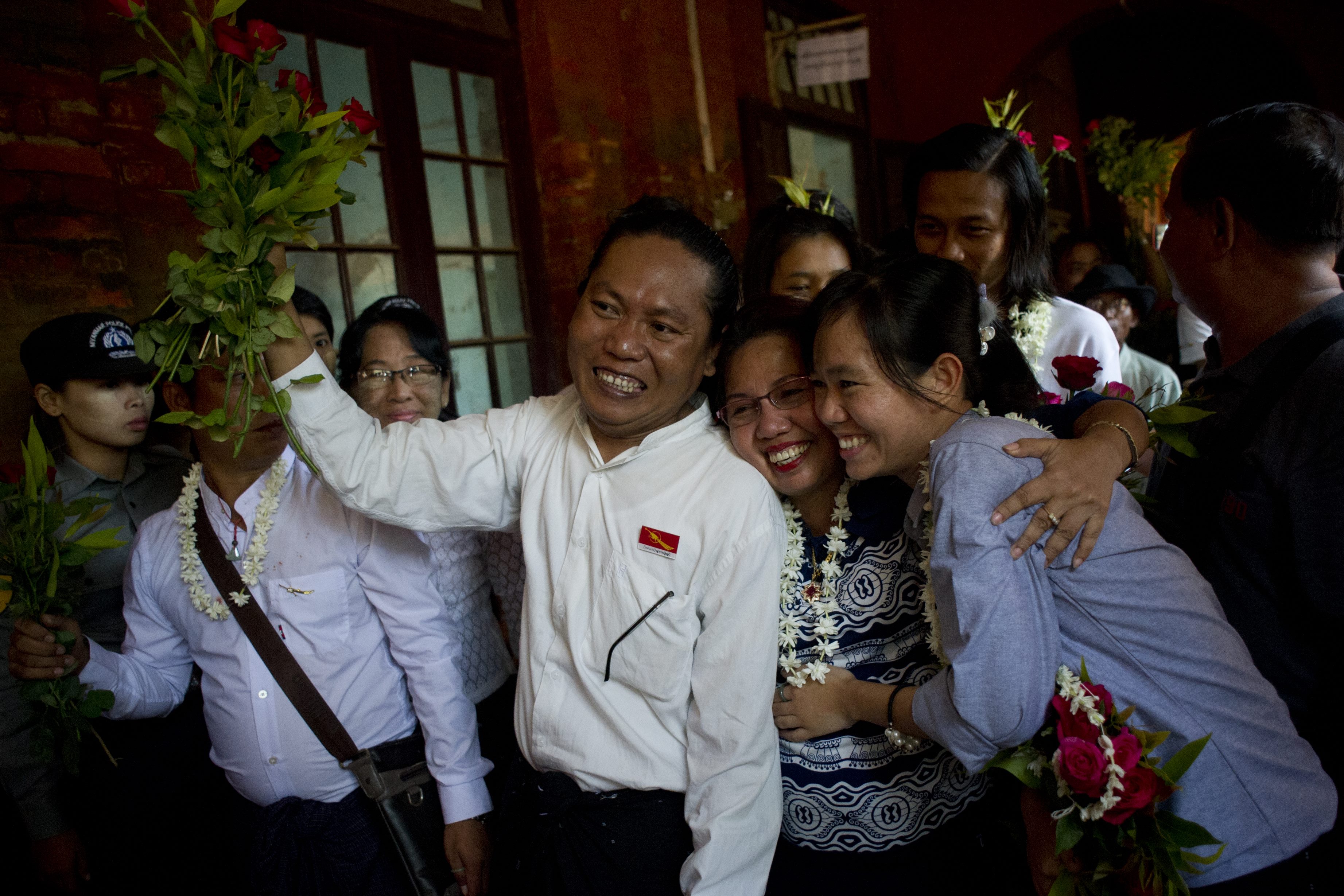 Family members welcome student protest leaders Nandar Sitt Aung (L) and Phyo Phyo Aung (R) as they arrives for a hearing at her trial in Tharrawaddy town, Bago Region in Myanmar on April 8, 2016. Myanmar's Aung San Suu Kyi on April 7, vowed to press for the release of political prisoners and student activists, hinting that a mass amnesty may be imminent as her government seeks to stamp its mark on power in the former junta-run nation. / AFP / YE AUNG THU        (Photo credit should read YE AUNG THU/AFP/Getty Images)